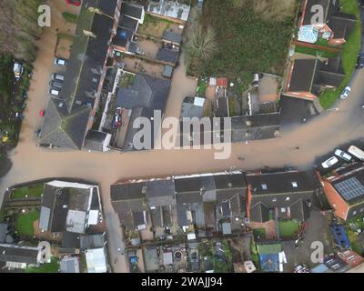 Gloucester, Gloucestershire, UK – Friday 5th January 2024 - UK Weather – Aerial drone view of flooding from the River Severn around Gloucester showing flooded properties at Alney Island on the edge of Gloucester city. The Environment Agency flood warning shows a river level of 4.70m at 10.30am this morning. Photo Steven May / Alamy Live News Stock Photo