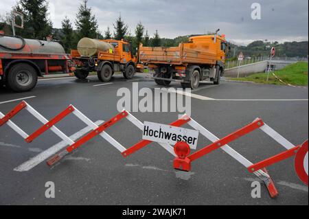 a warning sign for flooding or the danger of flooding warning sign flood and danger of flooding Stock Photo