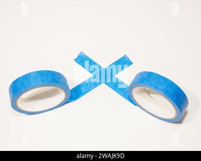 Blue all purpose decorators painters tape also used for crafts and woodworking isolated on a white background Stock Photo