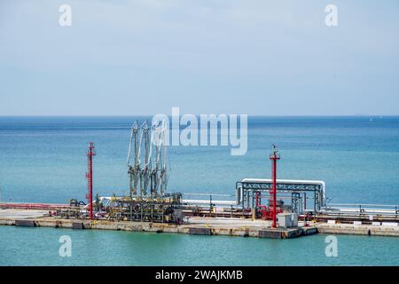 fuel gasoline, oil station installation on a marine dock quayside for ships and boats Stock Photo
