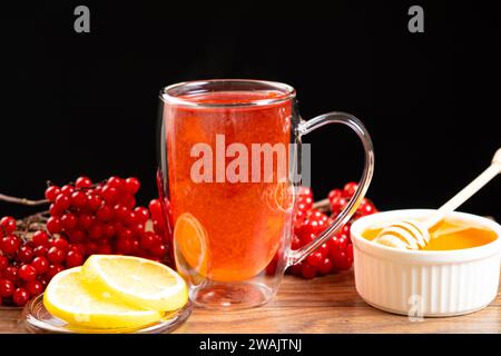 Vitamin berry viburnum tea with honey and lemon Stock Photo