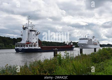 Cargo And Cruise Ship Meet In The North-Baltic Channel Stock Photo