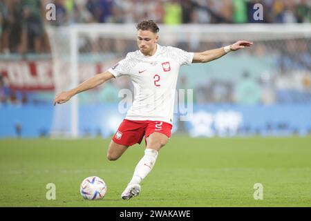 Matty Cash of Poland seen in action during the FIFA World Cup Qatar 2022 match between Poland and Argentina at Stadium 974. Final score; Poland 0:2 Argentina. Stock Photo