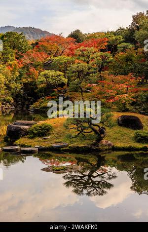 Autumn scenery is reflected in the water at Heichi Dam scenic area of ...