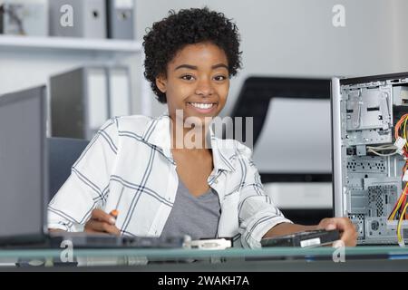 a happy woman pc engineer Stock Photo