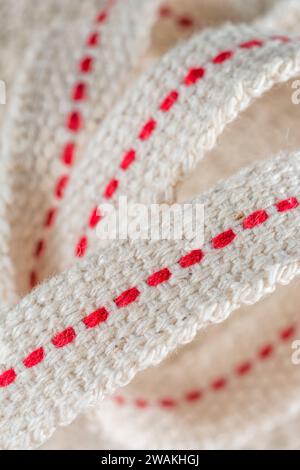 Close-up strip of flat cotton lamp wick, ready for emergency lighting when the power goes off. For being prepared, preppers, old forms of lighting. Stock Photo