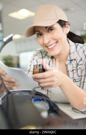 a woman on printer maintenance Stock Photo
