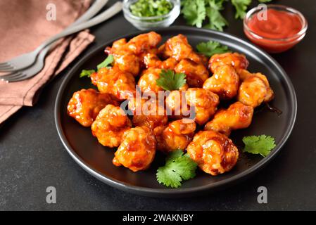 Sweet chili cauliflower wings on plate Stock Photo