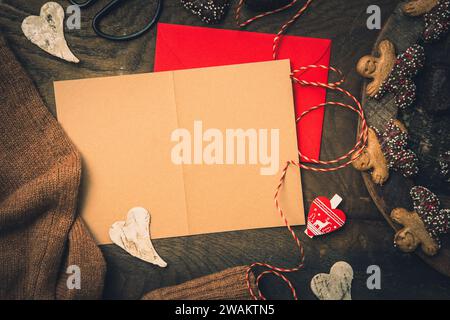 Scene for gifts in Advent with cookies, gift ribbon and card for text on dark wooden back ground, christmas concept. copy space, top view Stock Photo