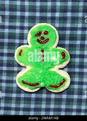 Homemade gingerbread man still life on a checked Blue and white tablecloth Stock Photo