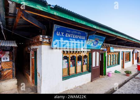 A row of typical local shops in Local shops in Chamkhar Town, Bumthang, in the central-eastern region of Bhutan Stock Photo