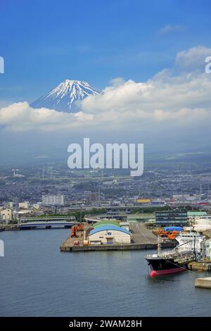 View over the city Fuji and Tagonoura Port with Mount Fuji in the background in spring, Shizuoka Prefecture, Japan Stock Photo