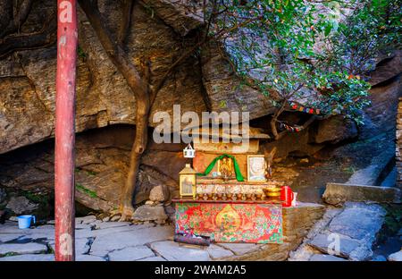 A small altar at Paro Taktsang (Taktsang Palphug Monastery, Tiger's Nest), a sacred Vajrayana Himalayan Buddhist cliffside site, Paro Valley, Bhutan Stock Photo