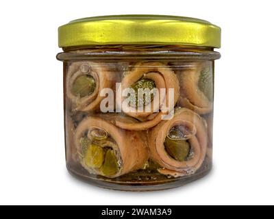 Rolled anchovy fillets with capers in oil in glass jar isolated on white with clipping path included Stock Photo