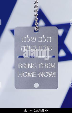 Bring Them Home Dog Tags. 5th January 2024. Next Sunday, 14th January, marks 100 days since 240 Israelis were abducted by Hamas during a deadly attack on Israel on 7th October 2023. These Freedom Tags, military style dog tags with the Hebrew text 'הלב שלנו שבוי בעזה - Halev shelanu shavui be'Aza, which translates as 'Our Heart Is Held Captive In Gaza' and 'Bring Them Home-Now!' in English are worn by people in support and solidarity with the families of those remaining in captivity.  Photo by Amanda Rose/Alamy Live News Stock Photo