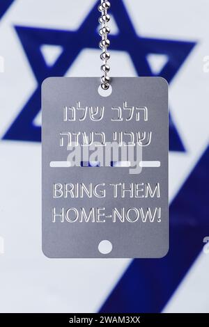 Bring Them Home Dog Tags. 5th January 2024. Next Sunday, 14th January, marks 100 days since 240 Israelis were abducted by Hamas during a deadly attack on Israel on 7th October 2023. These Freedom Tags, military style dog tags with the Hebrew text 'הלב שלנו שבוי בעזה - Halev shelanu shavui be'Aza, which translates as 'Our Heart Is Held Captive In Gaza' and 'Bring Them Home-Now!' in English are worn by people in support and solidarity with the families of those remaining in captivity.  Photo by Amanda Rose/Alamy Live News Stock Photo