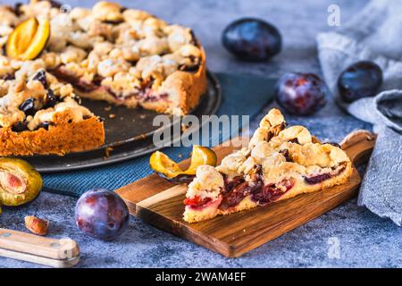 Homemade German plum cake (Zwetschgenkuchen) with yeast dough and crumbles Stock Photo