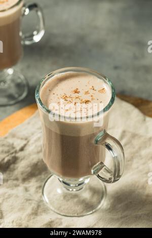 Homemade Festive Chocolate Eggnog with Nutmeg in a Glass Stock Photo