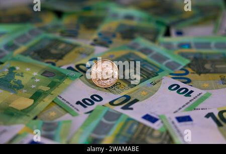 Danish krone , coin and banknotes Twenty Krone Coin on a one hundred Euro Note Stock Photo