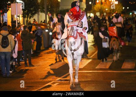 Aviles, Spain, January 05th, 2024: A page riding a horse during the Parade of HM Los Reyes Magos de Aviles, on January 05, 2024, in Aviles, Spain. Credit: Alberto Brevers / Alamy Live News. Stock Photo