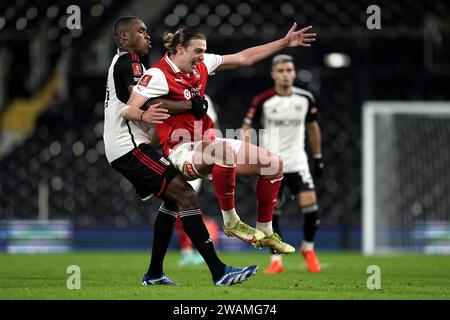 Rotherham United's Tom Eaves (right) and Fulham's Issa Diop battle for ...