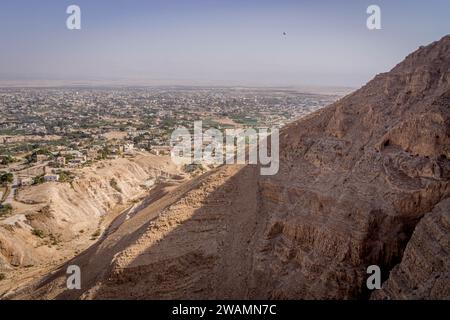 The view on the Mount of Temptation, a Christian shrine, with Jericho city in the background in West Bank, Palestine. Stock Photo