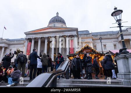 London, UK. 20th December, 2023. A Christmas market is pictured in front of the National Gallery in Trafalgar Square. Credit: Mark Kerrison/Alamy Live News Stock Photo