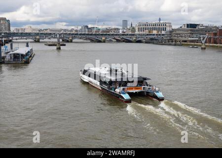 London, UK - March 18, 2023; Thames Clippers river boat Monsoon Clipper approaching Bankside seen from above Stock Photo