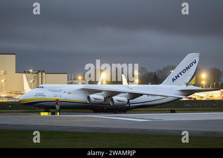 Everett, WA, USA - January 3, 2024; Ukrainian Antonov 124 international cargo transport aircraft at night Stock Photo