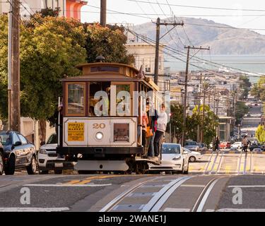 Cable Car rolling down Powell Street in San Francisco, California. Stock Photo