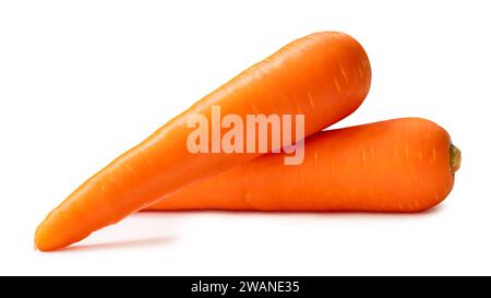 Fresh beautiful orange carrots vegetable in stack or pile are isolated on white background with clipping path. Stock Photo