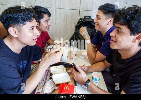 Merida Mexico,centro historico central historic district,McDonald's fast food,eating talking,teen teenage teenager,youth culture adolescent,resident b Stock Photo