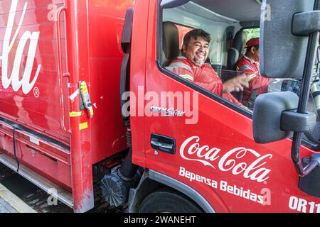 Merida Mexico,centro historico central historic district,Coca Cola delivery truck van,Bepensa Bebidas,man men male,adult,resident,driver deliveryman e Stock Photo