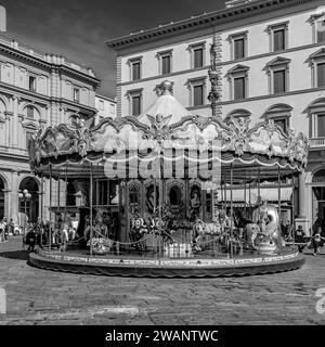 Black and white view of the ancient children's carousel in Piazza della Repubblica square in the historic center of Florence Italy Stock Photo