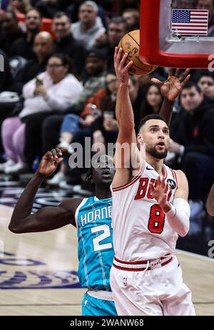 Chicago, USA. 5th Jan, 2024. Chicago Bulls guard Zach LaVine (R) drives to the basket during the NBA regular season game between Chicago Bulls and Charlotte Hornets in Chicago, the United States, Jan. 5, 2024. Credit: Joel Lerner/Xinhua/Alamy Live News Stock Photo