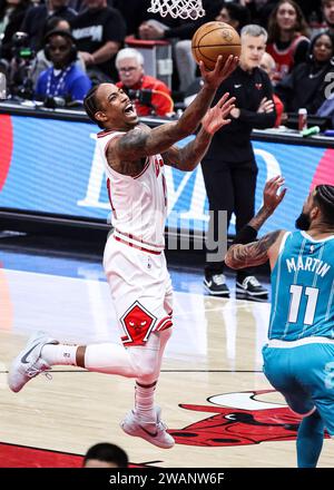 Chicago, USA. 5th Jan, 2024. Chicago Bulls forward DeMar DeRozan (L) drives to the basket during the NBA regular season game between Chicago Bulls and Charlotte Hornets in Chicago, the United States, Jan. 5, 2024. Credit: Joel Lerner/Xinhua/Alamy Live News Stock Photo