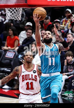 Chicago, USA. 5th Jan, 2024. Charlotte Hornets forward Cody Martin (R) drives to the basket during the NBA regular season game between Chicago Bulls and Charlotte Hornets in Chicago, the United States, Jan. 5, 2024. Credit: Joel Lerner/Xinhua/Alamy Live News Stock Photo