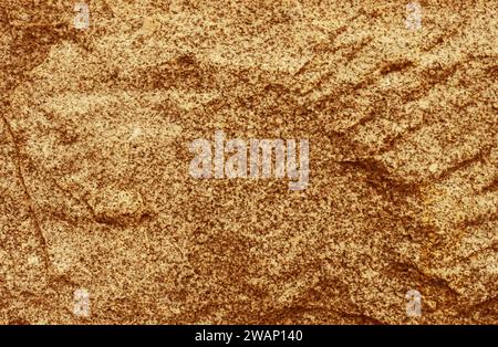 Yellow stone background. Toned stone texture. Texture for design with copy space. Stock Photo
