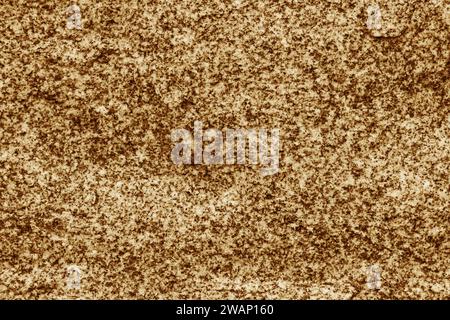 Yellow stone background. Toned stone texture. Embossed surface for design. Stock Photo