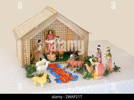 Simple crib displaying the nativity scene including the three kings, shepherds and an angel. Stock Photo