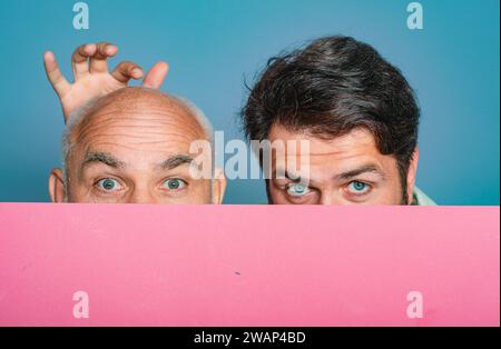 Bold senior man. Bald head. Portrait of a men combing himself. Hair transplantation. Bald man before and after surgery. Help with hair transplant Stock Photo