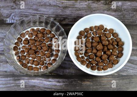 Breakfast Chocolate flavored balls cereal, as a snack prepared with milk for children and adults, crispy crunchy chocolate flavored balls, selective f Stock Photo