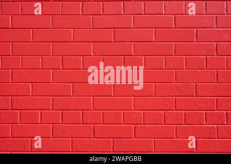 Background from a wall made of red painted bricks Stock Photo