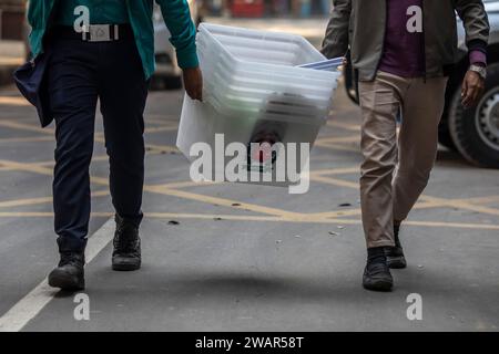 Dhaka, Bangladesh. 06th Jan, 2024. Security officers seen carrying ballot boxes for distribution ahead of the 2024 Bangladeshi general election. Bangladesh's main opposition party Bangladesh Nationalist Party (BNP) has boycotted the election and asked for a free and fair election. And more than 25 thousand of its supporters have been arrested. (Photo by Sazzad Hossain/SOPA Images/Sipa USA) Credit: Sipa USA/Alamy Live News Stock Photo