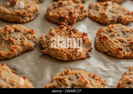 delicious fresh out of the oven baked keto almond flour cookies lined on parchment paper Stock Photo