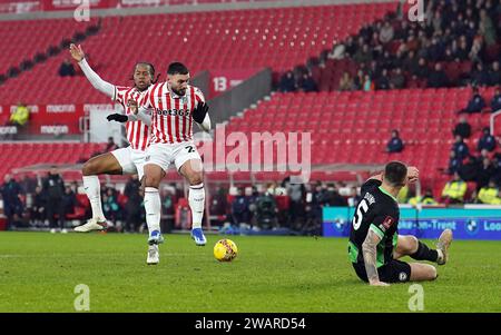 Stoke City's Daniel Johnson and team-mate Sead Haksabanovic go for the same ball as they attempt to score during the Emirates FA Cup Third Round match at the Bet365 Stadium, Stoke-on-Trent. Picture date: Saturday January 6, 2024. Stock Photo