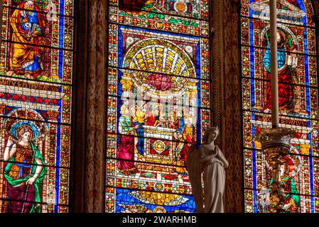 FLORENCE, ITALY - SEPTEMBER 21, 2023 - Colorful stained glass windows in the presbytery of basilica Santa Maria Novella in Florence, Italy Stock Photo