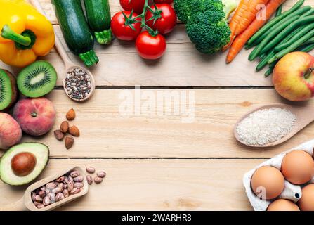 Healthy food background with various vegetable ingredients, fruits, vegetables, eggs, legumes, rice. top view with copy space - healthy living concept Stock Photo
