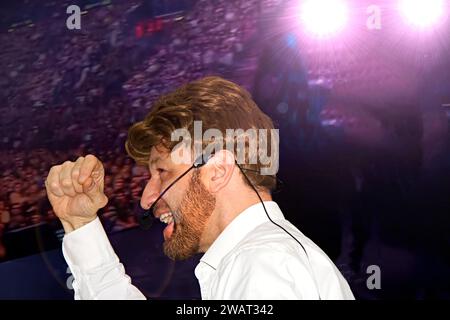 young attractive and confident successful guy speaking at corporate business coaching and training auditorium conference room talking giving motivatio Stock Photo