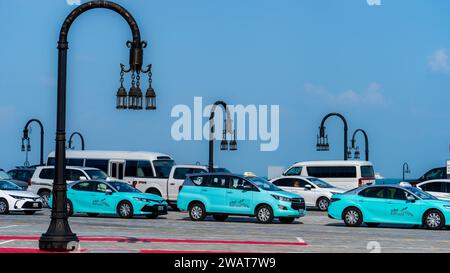 Doha, Qatar- December 12, 2023 - Various karwa taxis including van and car Stock Photo